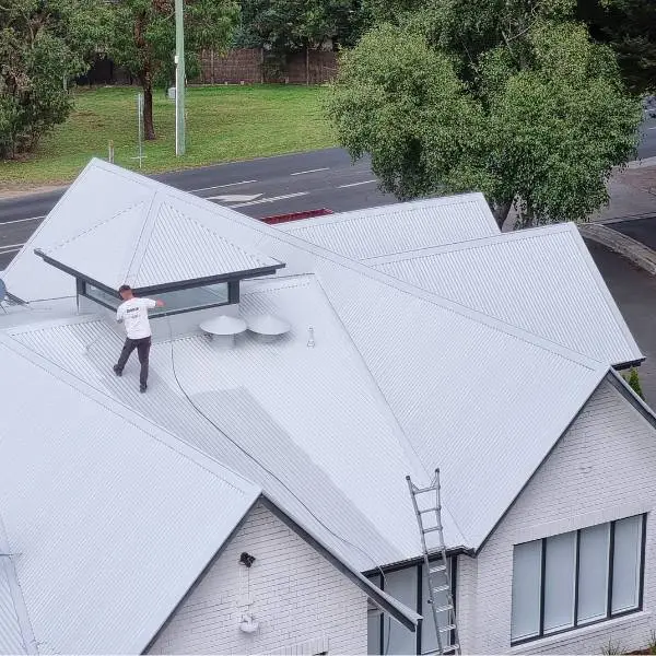 Metal roof restoration around an existing solar array — Roof Restoration Services Northern Suburbs Melbourne