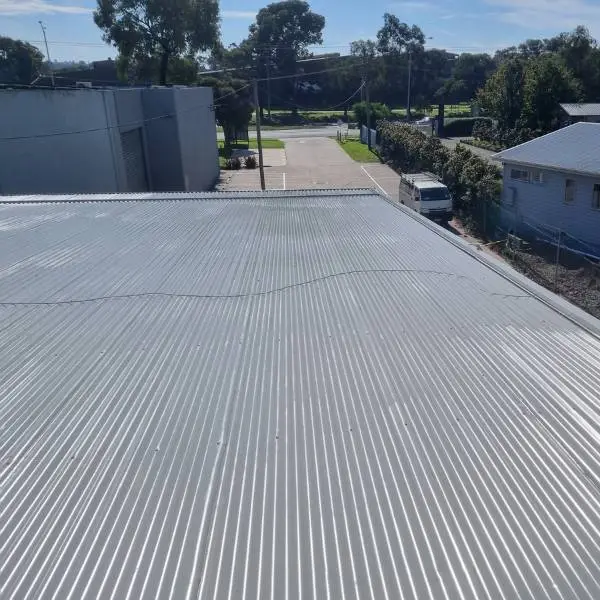 Rusted metal roof brought back — primed and membrane-coated — Roof Restoration Services Northern Suburbs Melbourne